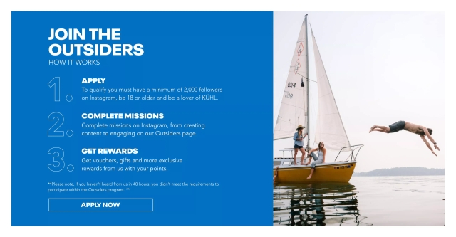 Three people at a lake having fun wearing Kühl clothes.